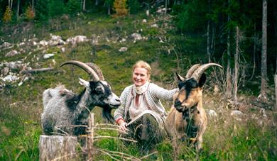 farm operator at Åsbergtunet, Anette, with goats