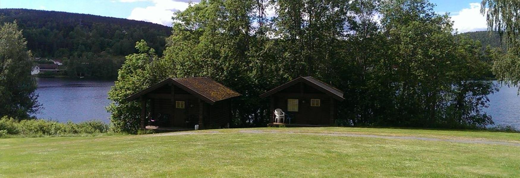 cabins by lake Norsjø at Gåsodden Camping